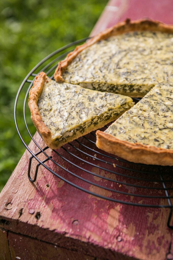 Quiche with spinach - traditional dish of french cuisine. Spinach tart